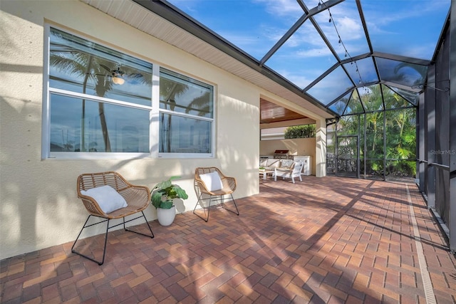 view of patio / terrace featuring glass enclosure