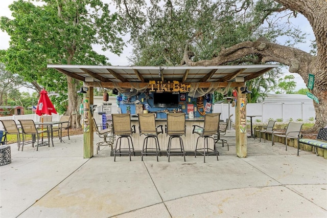 view of patio / terrace featuring an outdoor bar