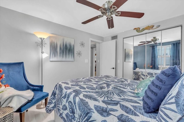 bedroom featuring ceiling fan and a closet