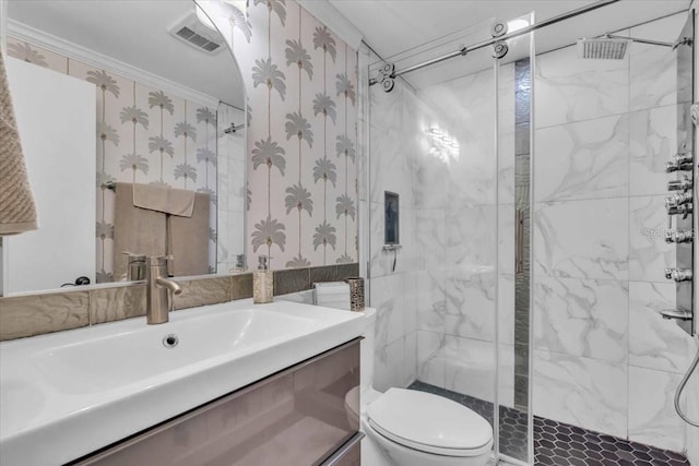 bathroom with a shower with shower door, toilet, vanity, and ornamental molding