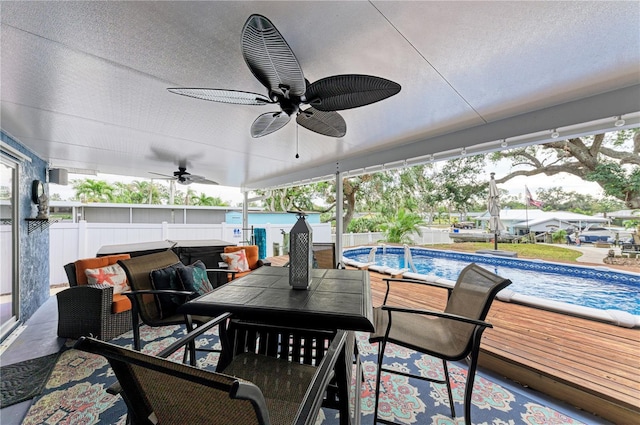 view of patio / terrace featuring ceiling fan and a swimming pool side deck