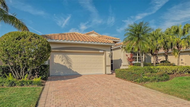 mediterranean / spanish-style house featuring a garage