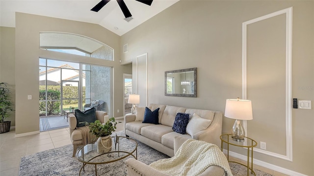 living room with light tile patterned floors, high vaulted ceiling, and ceiling fan