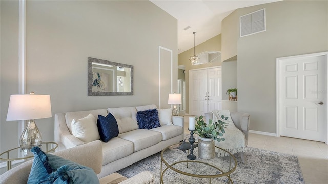 living room featuring high vaulted ceiling and light tile patterned floors