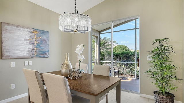 tiled dining area featuring a notable chandelier