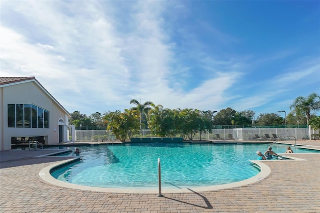 view of swimming pool with a patio