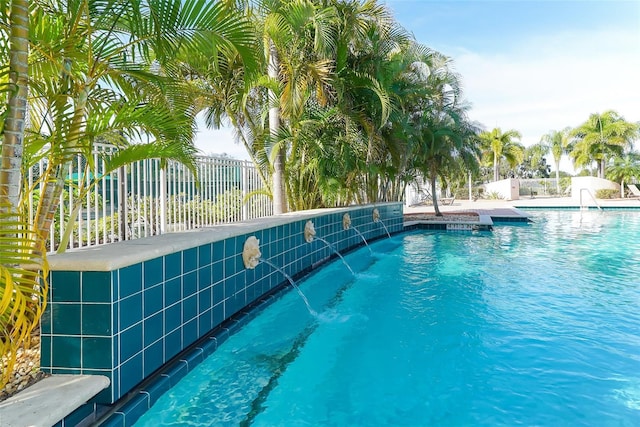 view of pool featuring pool water feature