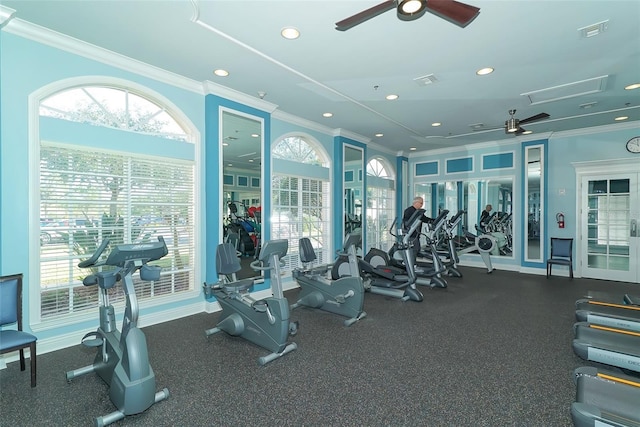 exercise room with crown molding and ceiling fan