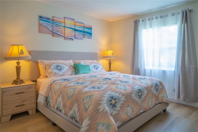 bedroom with light hardwood / wood-style flooring