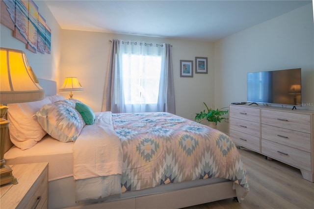 bedroom with wood-type flooring