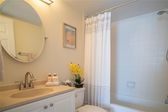 full bathroom featuring toilet, shower / bath combo, and vanity