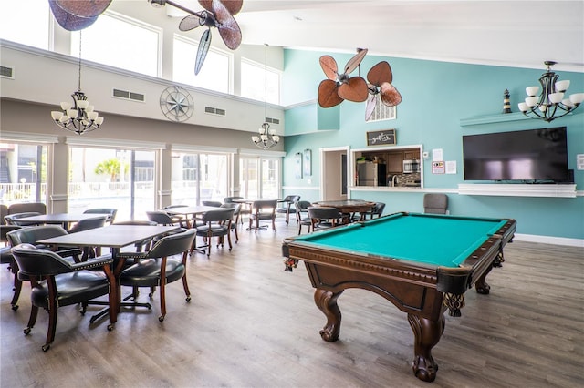 game room with ceiling fan, hardwood / wood-style flooring, billiards, and a high ceiling