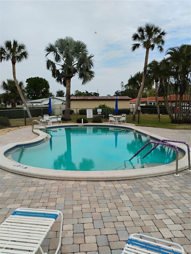 view of swimming pool featuring a patio area