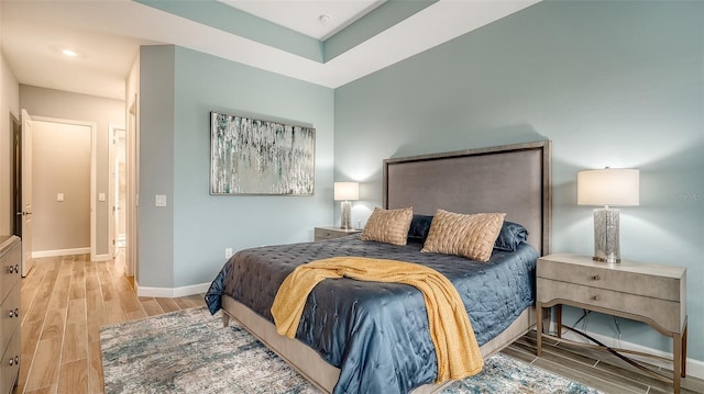 bedroom with light wood-type flooring