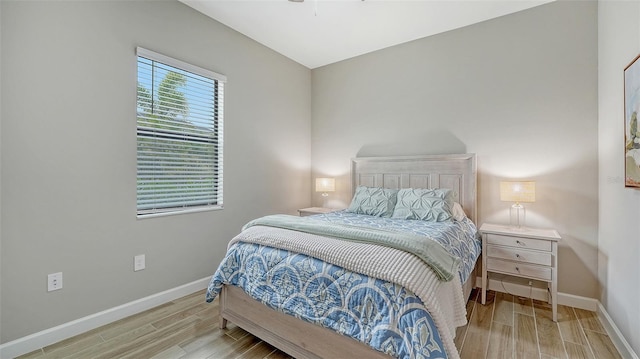 bedroom with light wood-type flooring