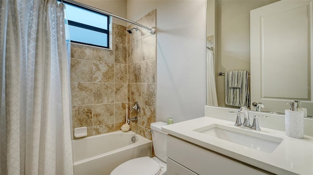 full bathroom featuring toilet, vanity, and shower / bathtub combination with curtain