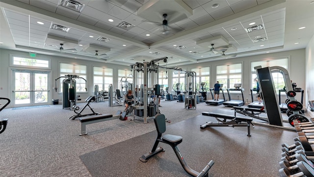 exercise room featuring ceiling fan, a paneled ceiling, and french doors