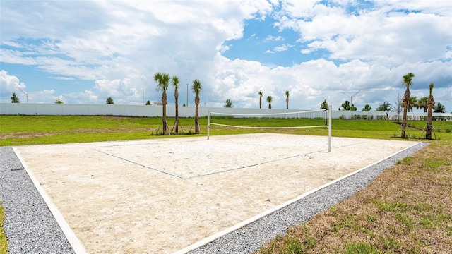 view of home's community featuring volleyball court and a yard