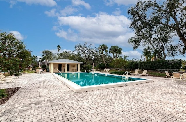 pool featuring a patio and fence