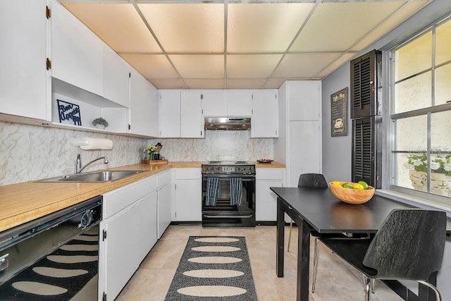 kitchen with white cabinets, a sink, under cabinet range hood, black appliances, and backsplash