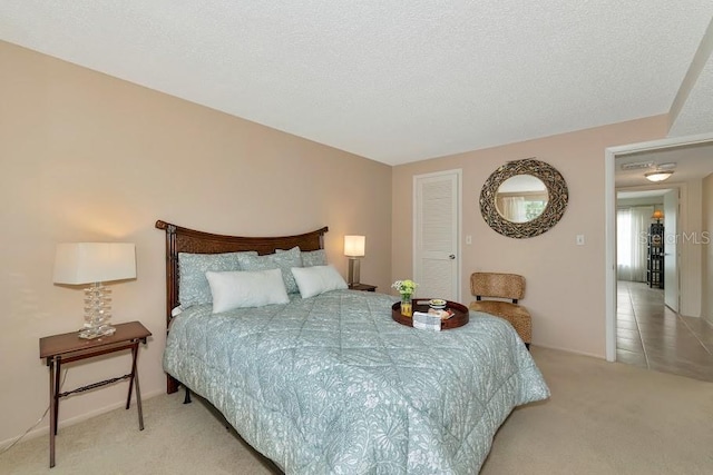 carpeted bedroom with a textured ceiling