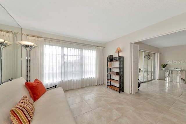 living area with light tile patterned floors