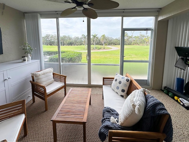 sunroom with ceiling fan and a wealth of natural light