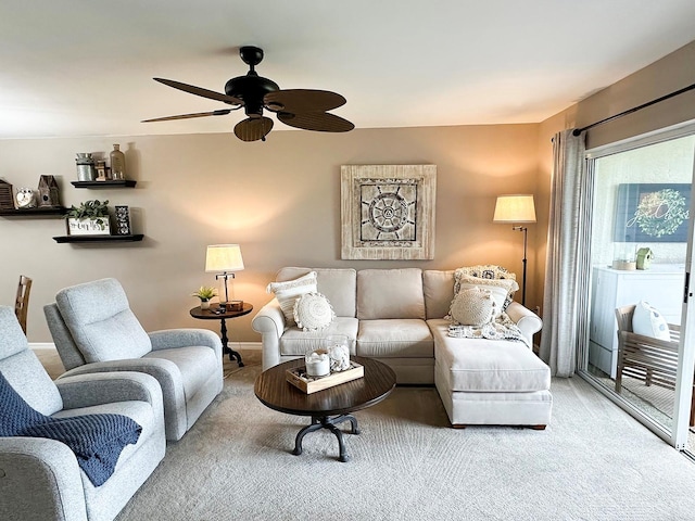 carpeted living room featuring ceiling fan