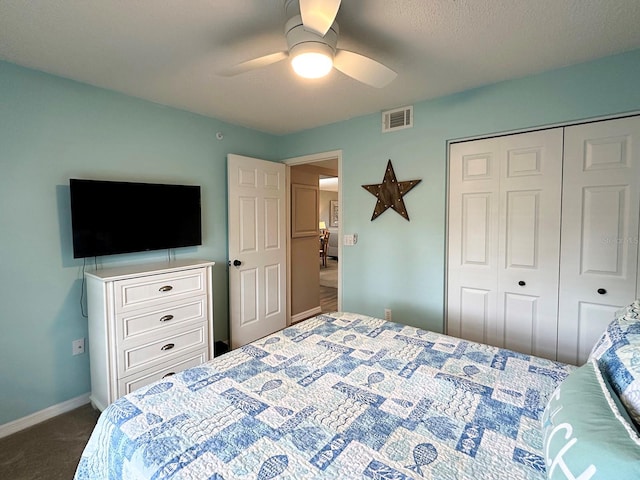 bedroom with ceiling fan, a closet, and carpet