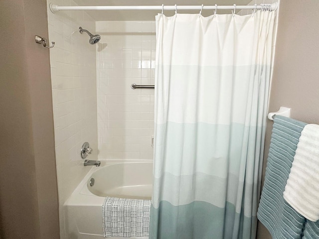 bathroom with shower / bath combination with curtain