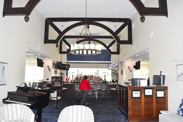 interior space featuring indoor bar and a chandelier