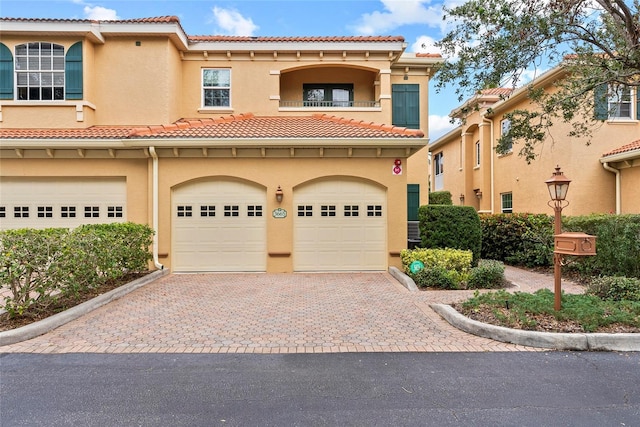 mediterranean / spanish house featuring a garage