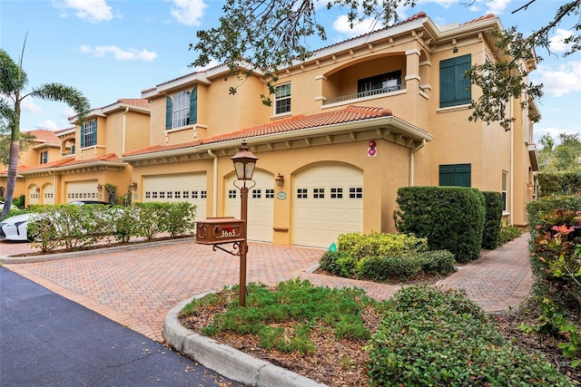 mediterranean / spanish house with a garage