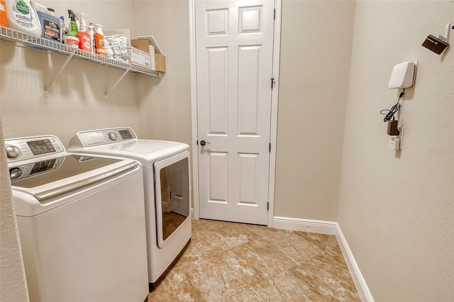 clothes washing area featuring independent washer and dryer