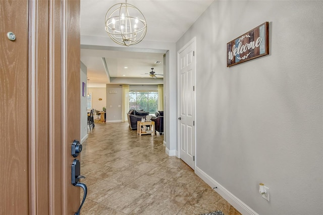 hallway featuring an inviting chandelier