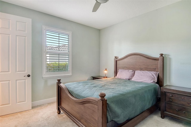 bedroom featuring light carpet and ceiling fan