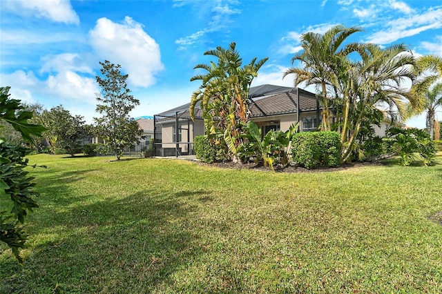 view of yard with a lanai