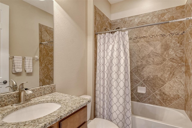 full bathroom with shower / bath combination with curtain, vanity, and toilet