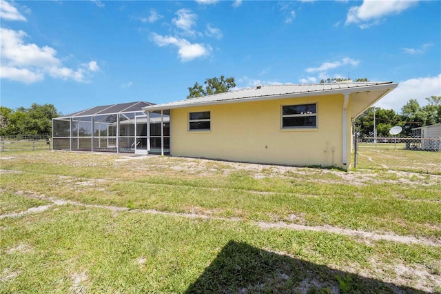 back of house with a yard