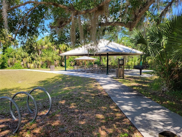 surrounding community with a gazebo and a lawn