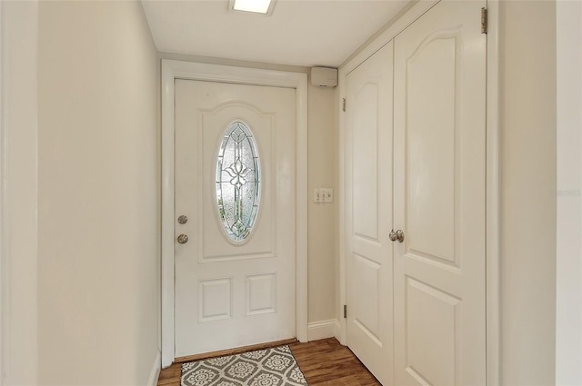 entryway with dark wood-type flooring