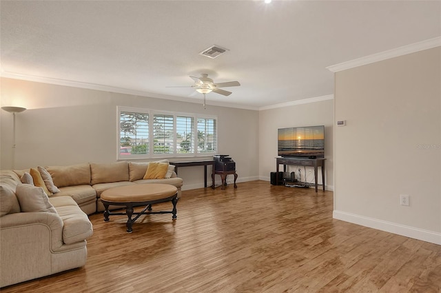 living room with ceiling fan, crown molding, and hardwood / wood-style floors