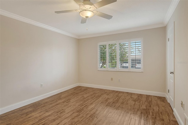 empty room featuring ceiling fan, crown molding, and hardwood / wood-style floors