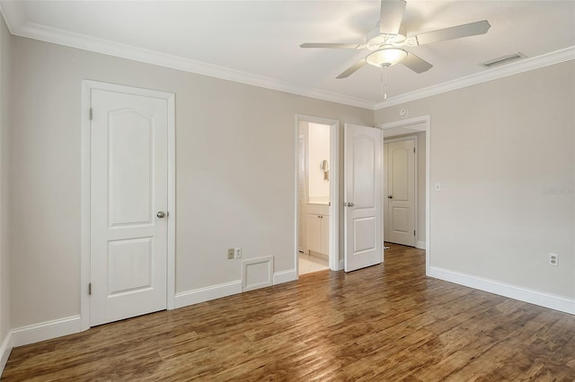 unfurnished bedroom with ceiling fan, crown molding, connected bathroom, and hardwood / wood-style floors