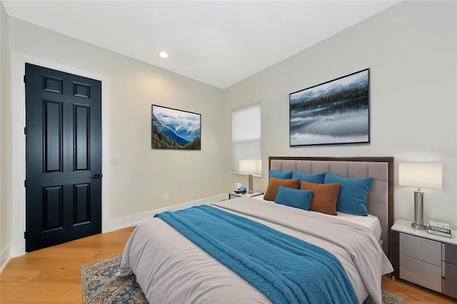 bedroom with light hardwood / wood-style flooring