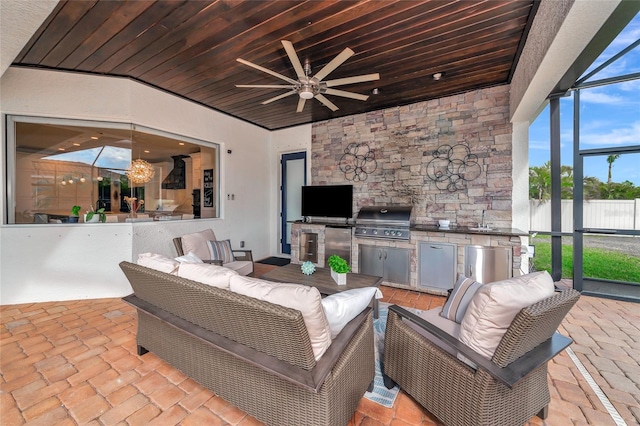 view of patio / terrace with outdoor lounge area, sink, ceiling fan, grilling area, and area for grilling