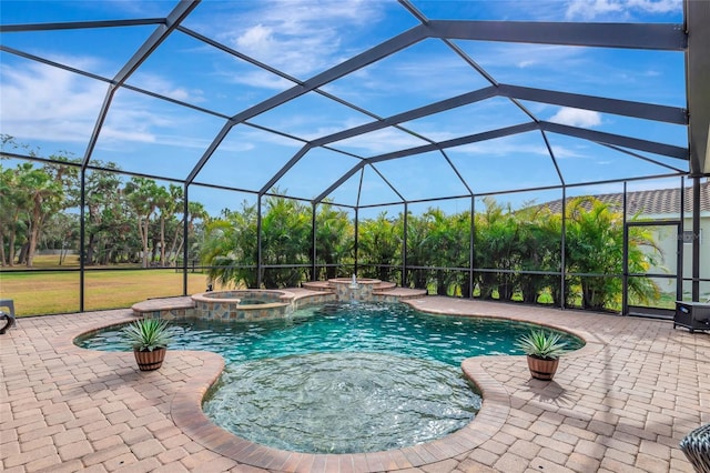 view of swimming pool with a patio area, glass enclosure, and an in ground hot tub