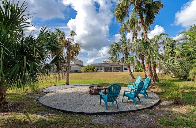 view of yard featuring an outdoor fire pit