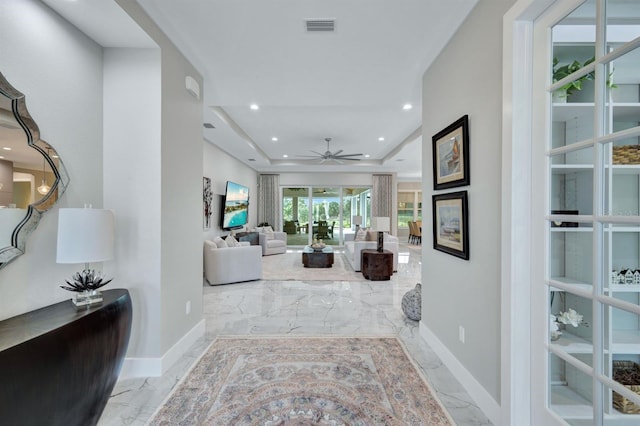 hallway featuring a raised ceiling