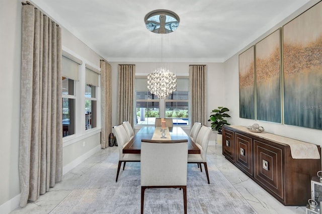 dining space featuring an inviting chandelier